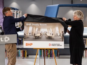 BHP president of potash Simon Thomas, left, and Saskatoon Public Library CEO Carol Cooley reveal a rendering of a planned study room at library's new central branch. The room will be funded by a $450,000 donation by BHP. Photo taken in Saskatoon, SK on Thursday, November 24, 2022.