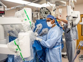 Urologist Dr. Varun Bathini prepares Daryl, a surgical robot, to perform a cancerous prostate removal at St. Paul's Hospital in October 2022. (Photo courtesy Saskatchewan Health Authority)