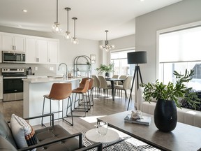 A uniquely shaped island, plenty of storage space and trendy white cabinets create a contemporary and timeless design that your family will enjoy for years to come.Scott Prokop's photo