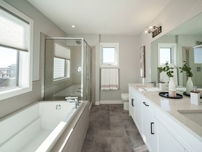 A 5-piece private bathroom at 502 Aniskotaw Way in Ehrenburg Homes makes for a cozy and luxurious room for the homeowner.Scott Prokop's photo