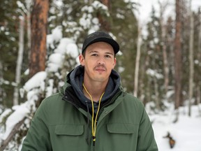 Matthew Maurer stands at a trailhead in La Ronge. In 2022, Maurer started leading evening and winter hikes in the trails around the town. (photo courtesy Megan Heyhurst Photography)