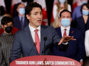 Canada's Prime Minister Justin Trudeau, with government officials and gun-control advocates, speaks at a news conference about firearm-control legislation that was tabled in the House of Commons in Ottawa, Ontario, Canada May 30, 2022. REUTERS/Blair Gable