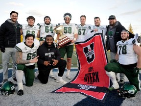 University of Saskatchewan Huskies' offensive lineman Jack Warrack (No. 67) poses with his fellow offensive linemen after winning the Uteck Bowl this past weekend. (Photo by Bryan Kennedy)