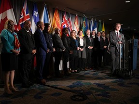 B.C. Health Minister Adrian Dix, front right, is flanked by his provincial counterparts as he listens to a question during a news conference after the first of two days of meetings, in Vancouver, on Monday, November 7, 2022.