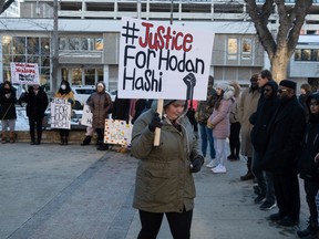 A supporter walks through the crowd at Hodan Hashi's vigil at City Hall on Nov. 19, 2022. PHOTO BY LIAM O'CONNOR / Saskatoon StarPhoenix