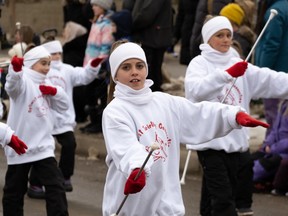 Kids from the Optimist Twirling Connection Dance School at Saskatoon's Santa Parade on Sunday.