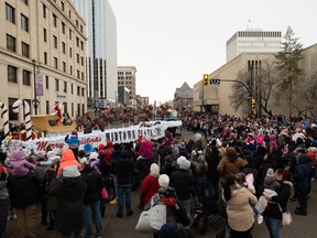 The crowd in front of the Midtown Plaza Mall cheers as the Santa float drives by in Saskatoon on Sunday.