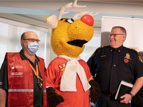 Saskatoon Millennium Lions Club president Tom Armstrong and Deputy Chief Randy Huisman launch the 14th annual Operation Red Nose campaign at the Ronald McDonald House. Operation Red Nose is a road safety campaign offering a safe ride home service to people who have been out celebrating. Photo taken in Saskatoon on Nov. 8, 2022.