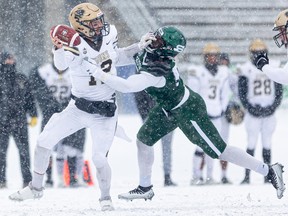 Saskatchewan's George Idoko puts the clamps on Bisons' quarterback Des Catellier during Saturday's conference semifinal at Griffiths Stadium. (Saskatoon StarPhoenix / Michelle Berg)