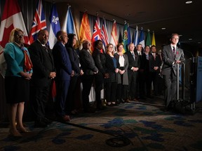 B.C. Health Minister Adrian Dix, front right, is flanked by his provincial and territorial counterparts as he listens to a question during a news conference after the first of two days of meetings, in Vancouver, on Monday, Nov. 7, 2022.
