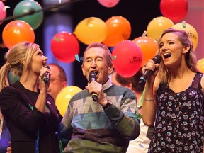 Beverley Mahood, left,  Bob McGrath and Leah Daniels sing during McGrath's last Telemiracle telethon at TCU Place in Saskatoon on March 8, 2015.