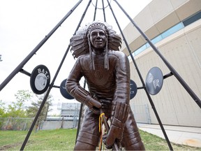 The Fred Sasakamoose bronze statue is unveiled at SaskTel Centre. Photo taken in Saskatoon, Sask. on Wednesday May 18, 2022.