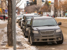 Vehicles line a downtown street in Sask Saskatoon, SK on Dec. 1, 2020.
