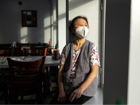 Hong (Rose) Tran sits in the window sill of her restaurant Saigon Rose, which she has owned and run for 40 years, on Jan. 24. She fled Vietnam in 1980 with her husband and two boys and has been working tirelessly to support her family in Canada.