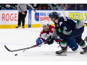 Edmonton Oil Kings' Josh William (left) dives past Seattle Thunderbirds' Kevin Korchinski (right) during second period WHL Championships action at Rogers Place in Edmonton, on Friday, June 3, 2022. Photo by Ian Kucerak
