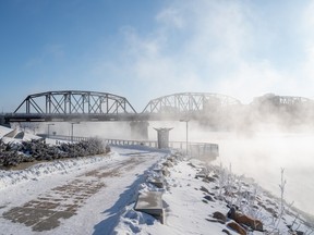 Mist from the extreme cold shrouds the Traffic Bridge in Saskatoon, Sask. on Tuesday, February 22, 2022.