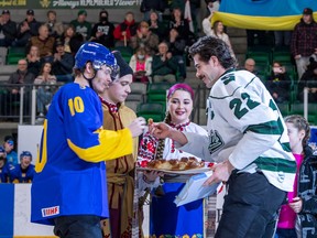 Ukraine team captain Vadym Mazur, 10, and University of Saskatchewan Huskies captain Connor Hobbs, 22, meet Friday for a ceremonial duel before the game at Merlis Belsher Place in Saskatoon to mark the Can't Stop Hockey Tour of western Canada to start.