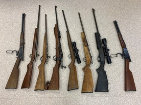 After responding to a report of an armed robbery on Dec. 21, 2022, La Ronge RCMP arrested four people and seized a gun safe with eight firearms inside. The safe had been reported stolen earlier that night. (Saskatchewan RCMP)