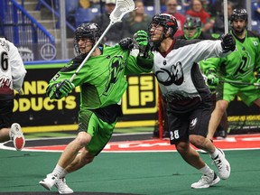 Saskatchewan Rush's Connor McClelland (left) takes on Colorado Mammoth in NLL action at SaskTel Centre on Dec. 3, 2022.