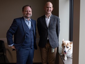 Chad Eggerman, left, and Troy Baril with Aura the dog at Procido LLP law firm, which they recently founded in the Birks Building in downtown Saskatoon.