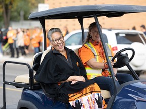 Judy Pelly, an Anishinaabe residential school survivor from Cote First Nation, is all smiles as she’s surrounded by thousands of supporters wearing orange during the Rock Your Roots Walk for Reconciliation on National Truth and Reconciliation day on Sept. 30. She works with 30 organizations in Saskatoon, as well as provincially, on issues of truth and reconciliation, intergenerational trauma, and hope and healing.