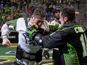 Saskatchewan Rush captain Chris Corbeil fights Charlie Bertrand of the Rochester Knighthawks during a 9-6 win Saturday night at SaskTel Centre on March 19.