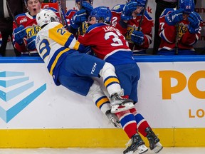 Edmonton Oil Kings Reid Larson (37) collides with Saskatoon Blades Jordan Keller (29) during first period WHL action on Wednesday, Nov. 30, 2022 in Edmonton. Greg Southam-Postmedia