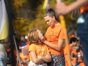 Steph Clovechok shares a moment with her daughter Shae during the Rock Your Roots Walk for Reconciliation on National Truth and Reconciliation day at Victoria Park on Sept. 30.