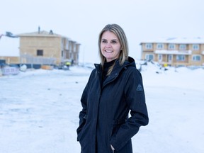 Nicole Burgess, SHRBA CEO, stands in front of the construction site of a new affordable housing development in Rosewood.