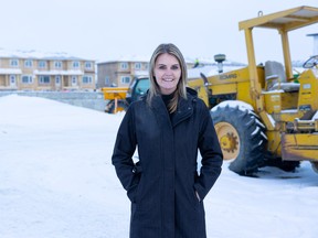 Nicole Burgess, SHRBA CEO, stands in front of the construction site of a new affordable housing development in Rosewood.