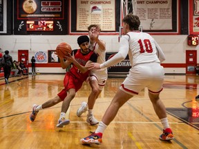 Harshan Natt (11) of Bedford Road drives the ball under pressure from Raymond defenders during the first game of the Bedford Road Invitational Tournament.