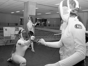 A photo of Dorothy Seaton, left, lunging with her foil at Nancy Bernard-Guiteo during fencing practice with the University of Saskatchewan Fencing Club, from Jan. 12, 1983.