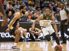 Best Sports front SASKATOON, SK--AUGUST 4/2022 - 0805 Sports Rattlers - Saskatchewan Rattlers guard Devonte Bandoo drives the ball past Edmonton Stingers guard Adika Peter-McNeilly during first half CEBL playoff action in Saskatoon, SK on Thursday, August 4, 2022.