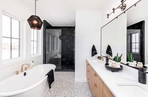 The ensuite bath is loaded with luxury touches, including a heated tile floor, custom shower, soaker tub, dual sink vanity and separate water closet.