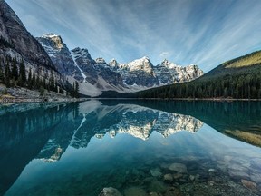 Moraine Lake reflection on a calm morning in Banff National Park, Alberta, in the heart of the Canadian Rockies.