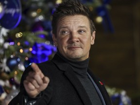 Jeremy Renner poses for photographers upon arrival at the UK Fan Screening of the film "Hawkeye," in London, Thursday, Nov. 11, 2021.