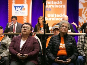 Survivors of a residential school that housed Metis children in Saskatchewan attend a media event in Whitecap, Sask., Tuesday, Jan. 24, 2023. The survivors have filed a proposed class-action lawsuit for harms suffered in the institution.