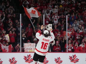 Canada's Connor Bedard carries the IIHF Championship Cup while celebrating winning gold over Czechia during overtime of the IIHF World Junior Hockey Championship gold medal game in Halifax on Thursday, January 5, 2023. The star of the recent world junior hockey championship isn't interested in the rear-view mirror or what waits over the horizon. That's for the rest of the hockey world to debate and discuss.