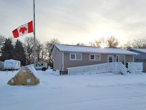 An upside down Canadian flag is displayed outside of a home in Cudworth, Saskatchewan. (Photo courtesy Brian Diederich)