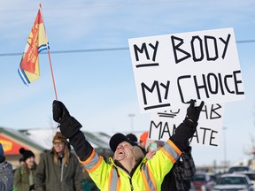 Hundreds gathered at 3850 Idylwyld Dr North in support of a convoy of truckers who passed through town to protest vaccine mandates. Photo taken at Saskatoon, Sask. on Monday, January 24, 2022.