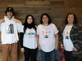 From left to right: Jacob Gardiner, Jasmyne Gardiner-Bird, Rhonda Gariner and Lisa Corrigal wear "Justice for John" shirts. Photo taken in Saskatoon, Sask. on Friday, Feb 3, 2023.