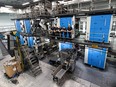 (from left) Rodney Kayter, Laird Macdonald, Michael Frank, Edward San Gaspar and Lloyd Mawson are the final five press operators to run the 10.7 metres tall, 24-year-old offset press at 204 Fifth Avenue North. The crew prepare for their final voyage -- printing the last issue of The StarPhoenix in Saskatoon on February 10, 2023. Photo taken in Saskatoon, Sask. on Wednesday, Feb 1, 2023. (Saskatoon StarPhoenix / Michelle Berg)