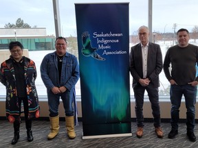 Saskatchewan Indigenous Music Association board members (L-R) Sheryl Kimbley, Donny Parenteau, Paul Lomheim and Roland Corrigal stand for a photo in Prince Albert, Sask. in January 2023.