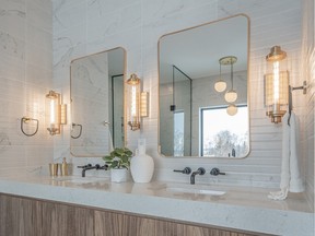 Tiles covering every surface, walnut wood accents and gold fixtures, transform the ensuite into a posh oasis for homeowners. SCOTT PROKOP PHOTOGRAPHY