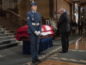 Ontario Premier Doug Ford pays his respects during the visitation for the former Ontario lieutenant-governor at the Queens Park Legislature in Toronto on Saturday, Jan. 28, 2023.