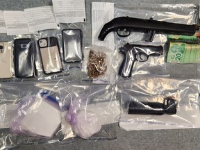 Prince Albert Police Service seized a sawed-off .22 rifle, ammunition, 831 g of cocaine, and just over $8,500 in cash in a raid in Prince Albert on Feb. 3, 2023.