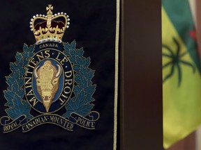 An RCMP insignia hangs from a podium during a press conference at Depot Division in Regina, Saskatchewan on April 19, 2018.