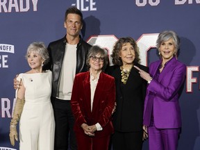 From left, Rita Moreno, Tom Brady, Sally Field, Lily Tomlin and Jane Fonda, cast members in "80 for Brady," pose together at the premiere of the film, Tuesday, Jan. 31, 2023, at the Regency Village Theatre in Los Angeles.