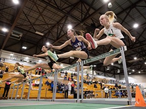 University of Saskatchewan's Rachel Albertson (right) competes in hurdles during the U Sports track and field nationals in Saskatoon on March 9.