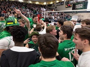 SASKATOON, SASK: Friday, March 10 – 0311 sports huskies vball – Huskies fans and team celebrate their win against the Calgary Dinos Friday night for Canada West bronze at the PAC. The winner advances to nationals. Photo taken in Saskatoon, Sask. on Friday, March 10, 2023.